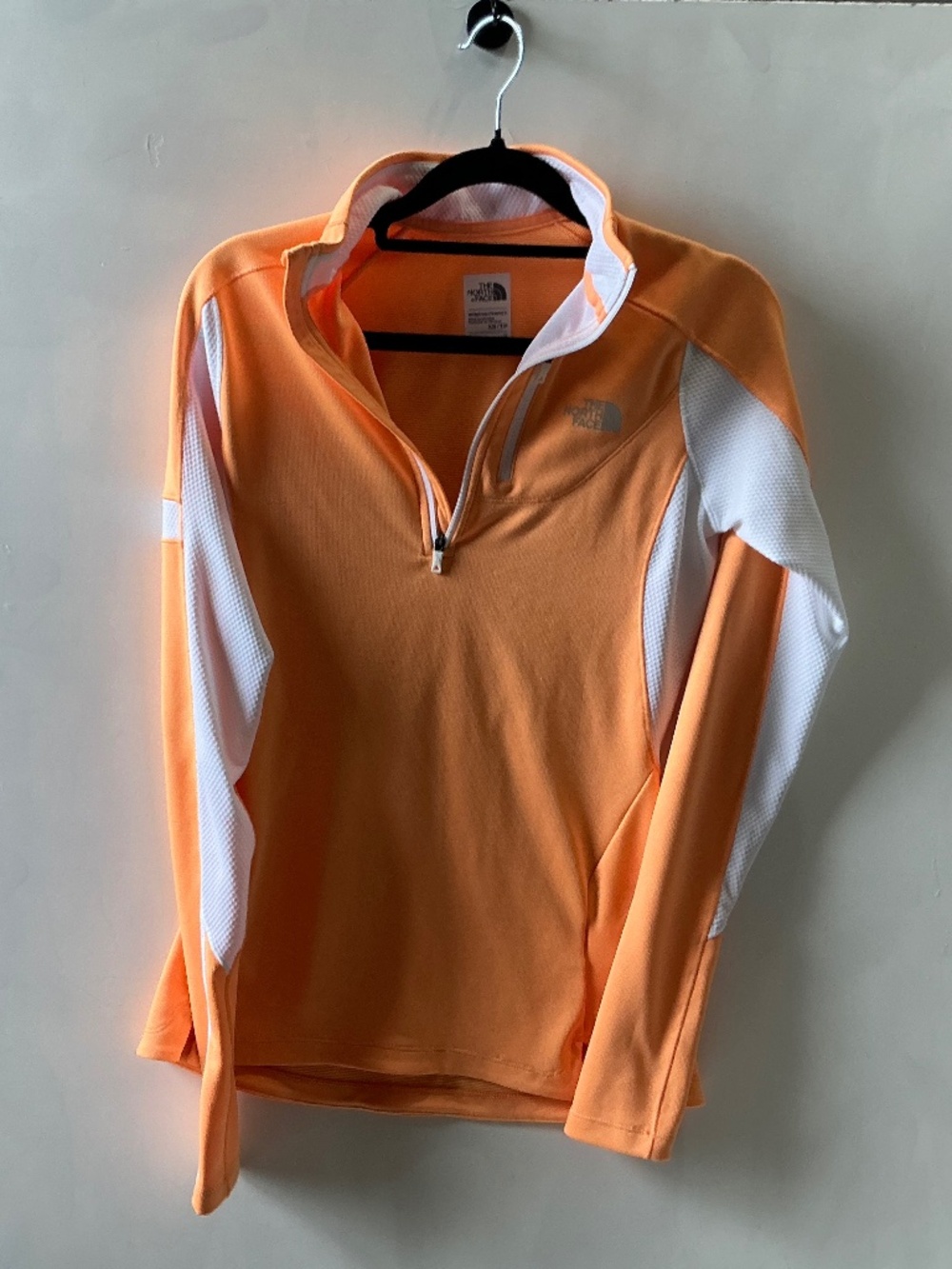 The North Face women’s pull over quarter zip orange and white size XS